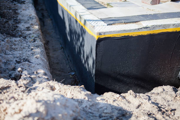 Professional Waterproofing technician working in Alpine, NJ